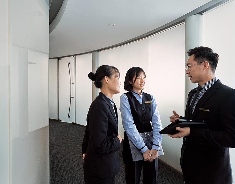 Students talking to lecturer