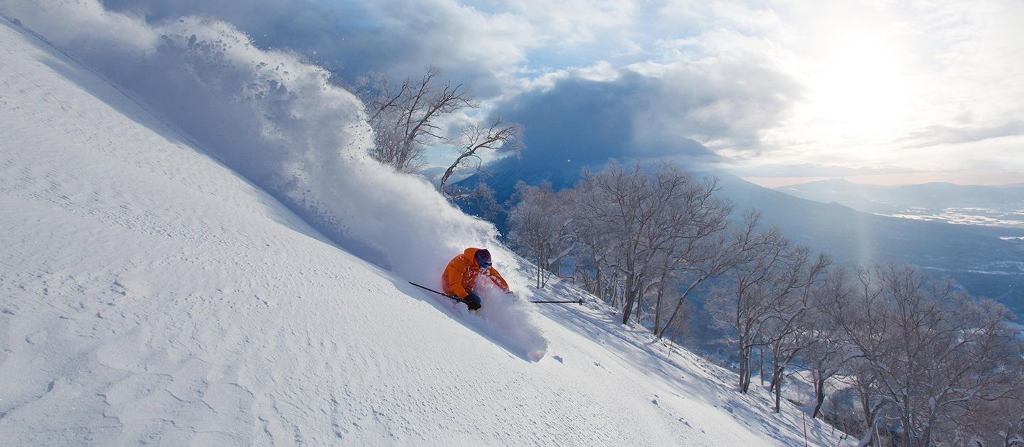 A man is skiing at Niseko, Japan
